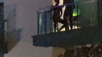 Guys caught shacking up on the balcony